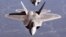 U.S. -- (FILES) This US Air Force file image shows two F/A-22A Raptor fighters in trailing formation in route to Hill AFB, Utah on October 15, 2005 for Combat Hammer exercise. CNN Reported on March 25, 2009 that an F-22A crashed near Edwards Air Force Bas