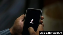 PAKISTAN -- A man opens social media app 'Tik Tok' on his cell phone, in Islamabad, July 21, 2020