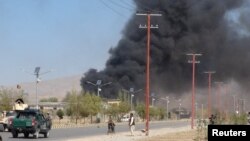 FILE: Smoke rises from the site of an attack in Gardez, the capital of southeastern Paktia Province.