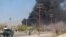 FILE: Smoke rises from the site of an attack in Gardez, the capital of southeastern Paktia Province.