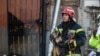 Пожежники на місці влучання російської ракети у будівлю в Києві. Район метро «Дорогожичі», 1 березня 2022 року<br>