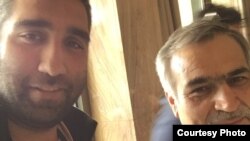 Iranian journalist Amir Hossein Motaqi (left), with Rohani's younger brother and adviser, Hossein Fereydoun 
