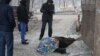 The body of a woman is seen on a street in Mariupol following shelling in January 2015. The UN says at least 9,600 people have been killed in the conflict in eastern Ukraine since April 2014.