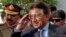 Pakistan - Pakistan's President Pervez Musharraf salutes as he leaves the Presidency following his resignation in Islamabad, 18Aug2008