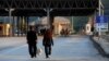 Kosovo -- A couple walk at the Kosovo-Macedonian border crossing near the town of Hani i Elezit, September 11, 2013