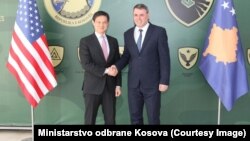 Deputy U.S. Assistant Secretary of State Hoyt Brian Yee (left) and the minister for Kosovo's security forces, Haki Demolli, in Pristina on March 29