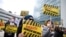 BOSNIA-HERZEGOVINA -- People display signs during a protest urging the government to obtain coronavirus disease (COVID-19) vaccines, in Sarajevo, April 6, 2021