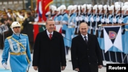 Путин (аз рост) ва Эрдуғон. 1-уми декабр. Анкара