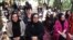 Afghan women attending an event to launch the My Red Line campaign in Herat on August 1.