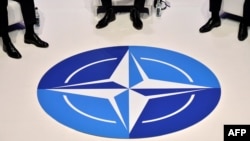 The Nato logo is pictured during a panel discussion at an official NATO outreach event