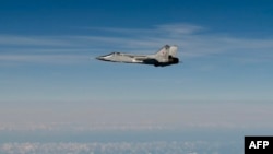 An image released by the Swedish Airforce shows a Russian MiG-31 fighter jet flying above the Baltic Sea after violating Estonian air space on September 19.