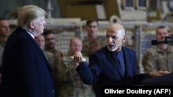 FILE: Afghan President Ashraf Ghani addresses U.S. troops during a surprise Thanksgiving day visit of U.S. President Donald Trump at Bagram Air Field on November 28, 2019.