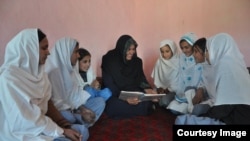 Aqeela Asifi with her students.