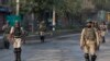 Indian paramilitary soldiers patrol during curfew in Srinagar on August 7.