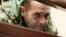 Ukrainian sailor Yuriy Budzylo, who was detained by Russia off the Crimean coast, appears at a court hearing at Simferopol's Kyievsky District Court on November 27.