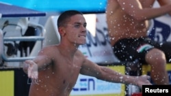 Поповичи след спечелването на финала на 100 м, Рим.