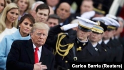 U.S. President Donald Trump listens to the national anthem after his swearing-in.