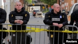 USA, Charlottesville, Virginia State police stand guard at the crime scene where a vehicle plowed into a crowd of counter protesters 13avg2017