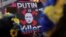 Во время акции «Стоп геноциду народа Украины» против вторжения России в Украину. На плакате надпись на английском: «Путин – убийца». Нью-Йорк, США, 9 апреля 2022 года