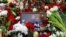 Flowers piled up near the grave of late opposition leader Aleksei Navalny in Moscow after tens of thousands of people stood outside the church where his funeral was held on March 1. 