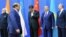 Pakistani Prime Minister Nawaz Sharif (second from left) walks past (left to right) Indian Prime Minister Narendra Modi, Chinese President Xi Jinping, Kazakh President Nursultan Nazarbaev, and Russian President Vladimir Putin as he arrives for group photo at the Shanghai Cooperation Council summit in Astana on June 9.