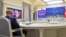 Russian President Vladimir Putin attends by a video conference a trilateral meeting with the leaders of Iran and Turkey on the topic of Syria, in Moscow on July 1, 2020.