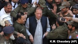 Pakistani former Prime Minister Nawaz Sharif arrives at a court in Lahore on October 11.