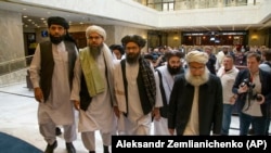 Mullah Abdul Ghani Baradar, the Taliban's top political leader (third from left), arrives with other members of the Taliban delegation for talks in Moscow on May 28.