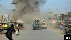 Smoke billows from the scene of a suicide bomb attack in the northern Afghan province of Kunduz on February 10.