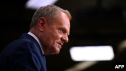 Poland's Prime Minister Donald Tusk gives a press conference after working sessions at the European Council in Brussels on June 26, 2025.
