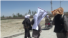 FILE: Taliban fighters in a ruler region of Afghanistan's Ghazni Province.