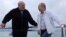 Pushing ahead with crackdowns: Russian President Vladimir Putin (right) and Belarusian leader Alyaksandr Lukashenka on the Black Sea on May 29.