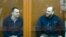 The former chief of the cybercrime department at Russia's FSB security service, Sergei Mikhailov (left), and Ruslan Stoyanov, a former employee of the cybersecurity firm Kaspersky Lab at their court hearing in Moscow on February 26. 