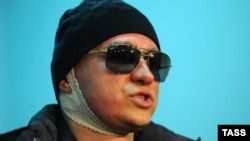 Sergei Filin speaks to journalists as he leaves a Moscow hospital on February 4.