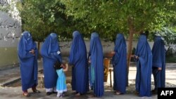 Women line up to vote in Jalalabad, Afghanistan, on June 14