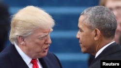 U.S. President Barack Obama (right) greets Donald Trump before the latter's inauguration ceremony on the steps of the U.S. Capitol Building.