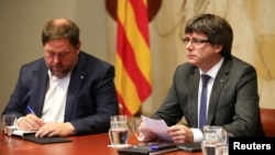 Оріол Жункерас (л) і Карлес Пучдемон (п), фото 2 жовтня 2017 року