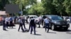 Police officers detain a man after an attack in the centre of Almaty, Kazakhstan on July 18, 2016. 