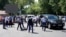 Police officers detain a man after an attack in the centre of Almaty, Kazakhstan on July 18, 2016. 