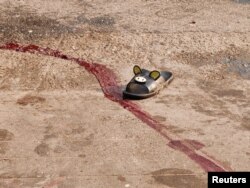 Катаал жазалоодон кийин... Янгон шаарынын чет жакасы. 2021-жылдын 27-марты.