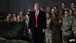 US President Donald Trump speaks to the troops during a surprise Thanksgiving day visit at Bagram airbase in 2019. 