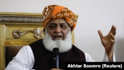 Maulana Fazlur Rehman gestures during a press conference in Islamabad on October 22.