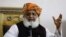 Maulana Fazlur Rehman gestures during a press conference in Islamabad on October 22.