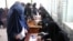 Women cast their votes in Kandahar during the flawed parliamentary elections in Afghanistan in October 2018. A lack of credible information about the biometric system could hamper their participation in the upcoming presidential election.
