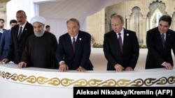 (Left to right:) Azerbaijani President Ilham Aliyev, Iranian President Hassan Rohani, Kazakh President Nursultan Nazarbaev, Russian President Vladimir Putin, and Turkmen President Gurbanguly Berdymukhammedov attend an event on the sidelines of the Caspian Sea summit in Aqtau on August 12. 