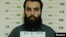 Afghanistan -- Anas Haqqani, a senior leader of the Haqqani network, arrested by the Afghan Intelligence Service (NDS) in Khost province is seen in this handout picture released October 16, 2014.
