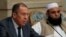 Russian Foreign Minister Sergei Lavrov (left) and Taliban delegate Alhaj Mohammad Sohail Shaina take part in multilateral peace talks on Afghanistan in Moscow in November 2018. 