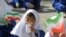 Iran-Pupil girls is waiting to ring the bell in the compouned primary school,2007