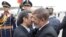 Deposed Egyptian President Muhammad Morsi (right) greets Iranian President Mahmud Ahmadinejad in Cairo in February.