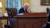 U.S. President Joe Biden speaks by phone with Ukrainian President Volodymyr Zelenskiy in the Oval Office at the White House in Washington.